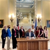 2)	Governor Kevin Stitt is surrounded by supporters as he signs Senate Bill 17 into law on Wednesday, August 4, 2021.